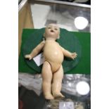 KAMMER & REINHARDT FOR SIMON & HALBIG DOLL a small doll with open mouth and composition body and