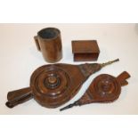 TREEN A pair of bellows and another smaller , each with turned central boss, a Victorian quart
