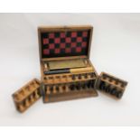 VICTORIAN GAMES COMPENDIUM an oak case containing a variety of games including a boxwood and ebony