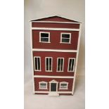 ANTIQUE DOLLS HOUSE a 3 storey dolls house with brick effect front, glazed windows and a pitched