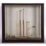 CASED MODEL YACHT 'DAUNTLESS' - ROYAL TORQUAY YACHT CLUB, 1925 a wooden model of a Schooner Yacht