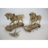 PONY SKIN PULL ALONG HORSES two similar Pony skin covered pull along horses, both mounted on
