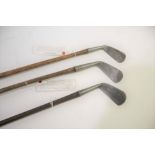 EARLY GOLF CLUBS 3 clubs including a hickory shafted lofting iron by Tom Stewart with clay pipe mark