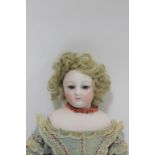 19THC FRENCH FASHION DOLL possibly by Borrois, the small doll with fixed blue eyes, painted closed