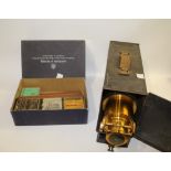 MAGIC LANTERN & SLIDES a cased Magic Lantern with a brass 10 1/2" lens, marked on the lantern Patent