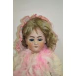 LARGE BISQUE HEAD DOLL - SIMON & HALBIG, JUTTA with weighted blue eyes, open mouth and pierced ears.