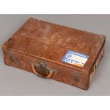 VINTAGE LOUIS VUITTON LEATHER SUITCASE an early 20thc plain leather suitcase, with brass studded and