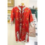 CHINESE SILK EMBROIDERED GOWN a 20thc red and white silk gown with embroidered decoration to front