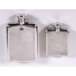 TWO SILVER SPIRIT FLASKS including a large rectangular shaped spirit flask with a hinged lid, marked