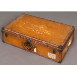 VINTAGE LOUIS VUITTON SUITCASE an early 20thc canvas suitcase with leather trim and studded brass