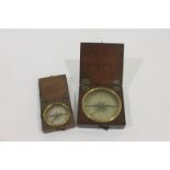 COMPASSES Two travelling compasses each with printed paper dial 6 cm and 4 cm dia respectively in