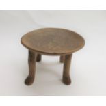 AFRICAN TRIBAL STOOL probably East African (Kamba), the hardwood stool with a dish shaped top and