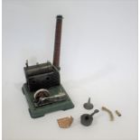 MODEL STEAM ENGINE a tin plate stationary model of a horizontal steam engine with fly wheel and