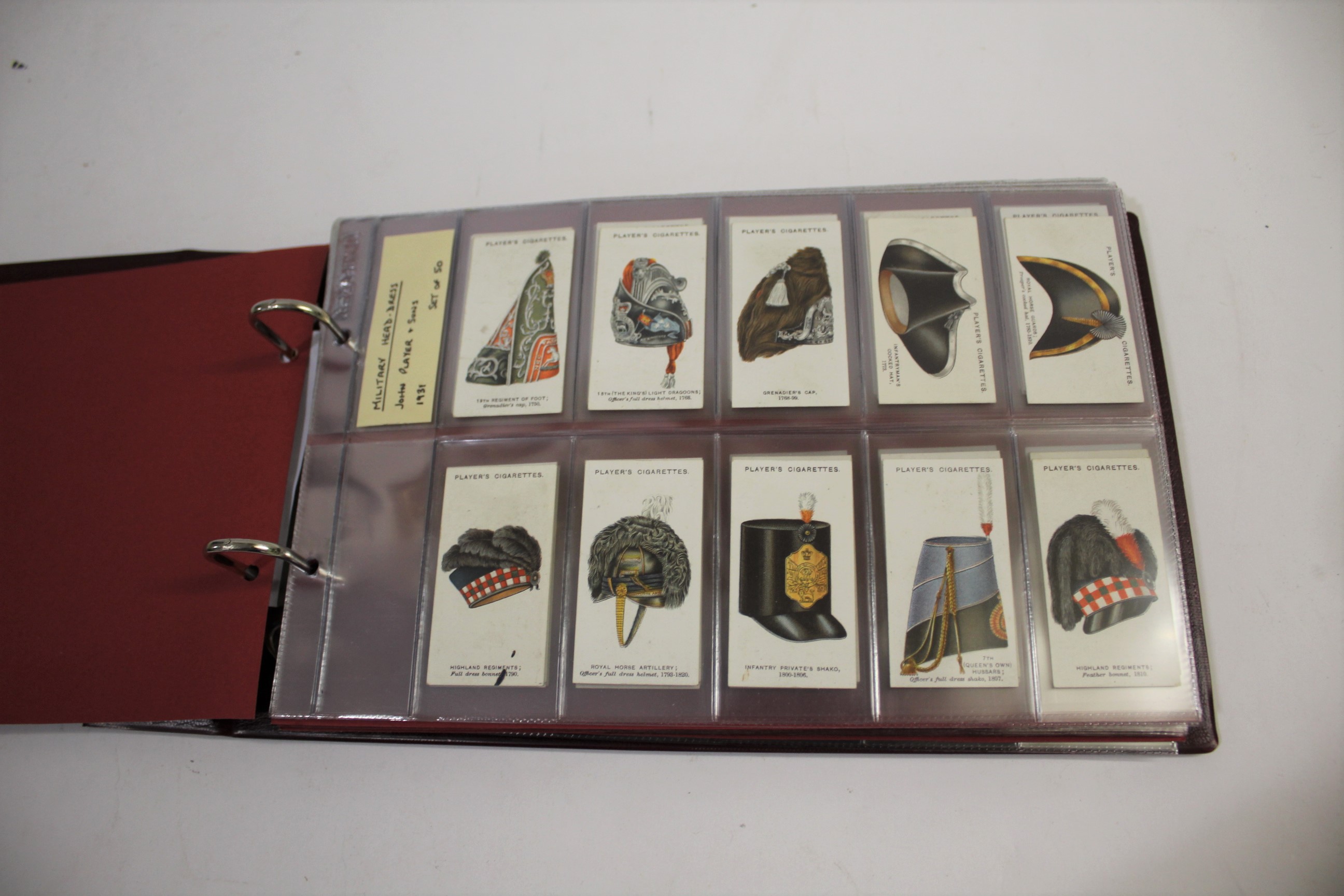 COLLECTION OF CIGARETTE CARDS including 4 albums, subjects include Players Military Head-Dress (