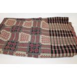 WELSH BLANKET a mid 20thc Welsh wool woven blanket, worked in black, red and grey. 219cms by 187cms