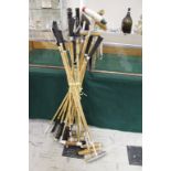 VINTAGE POLO MALLETS a collection of 12 vintage polo mallets, also with a polo helmet. (13)