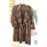 FUR COAT a full length brown fur coat with lined interior and single pocket. 120cms long