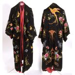 A BLACK SILK KIMONO ROBE an early 20thc black silk kimono robe, embroidered with flowers, insects