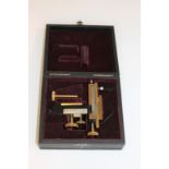 ERNST LEITZ - CASED MICROSCOPE STAGE a brass and metal mechanical stage, which can be attached to