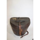 LEATHER CASED TOP HAT a leather hat box with a lined interior, containing a black Top Hat by Gerrard