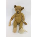 EARLY STEIFF TEDDY BEAR with elongated limbs and hump back, in generally poor condition and foot