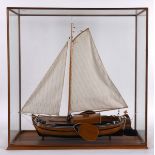 MODEL SHIP - DUTCH YACHT a wooden model ship of a Dutch Yacht, complete with sails and rigging. On a