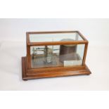 SHORT & MASON BAROGRAPH a barograph with a clockwork mechanism (in working order), in an oak case.