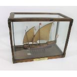 CASED MODEL SHIP - BARBARY COAST FELUCCA a wooden model ship with sails and rigging, oars on both