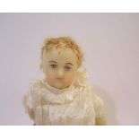 19THC WAX DOLL a large doll with a wax head and shoulder plate, with glass eyes and painted mouth