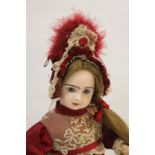 JUMEAU KISS THROWING DOLL an unusual kiss throwing and walking Jumeau doll, the pale bisque head