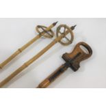 VINTAGE SHOOTING STICK & SKI POLES a vintage wooden shooting stick with fold up seat supported by