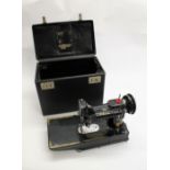 SINGER SEWING MACHINE - 222K a Singer 222K Featherweight portable sewing machine, in a fitted case