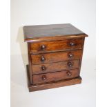 MINIATURE ROSEWOOD CHEST OF DRAWERS probably 19thc with 4 drawers, the top drawer with smaller