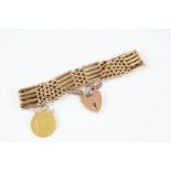 A 9CT. GOLD FANCY GATE LINK BRACELET formed with foliate engraved and plain links, with padlock