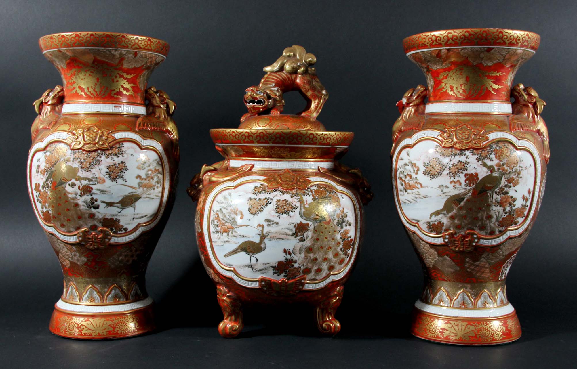 JAPANESE KUTANI GARNITURE OF VASES, the central ovoid vase and cover flanked by a pair of baluster