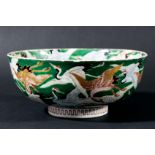 JAPANESE BOWL, circa 1900, enamelled and gilt with cranes on a green ground, iron red four character