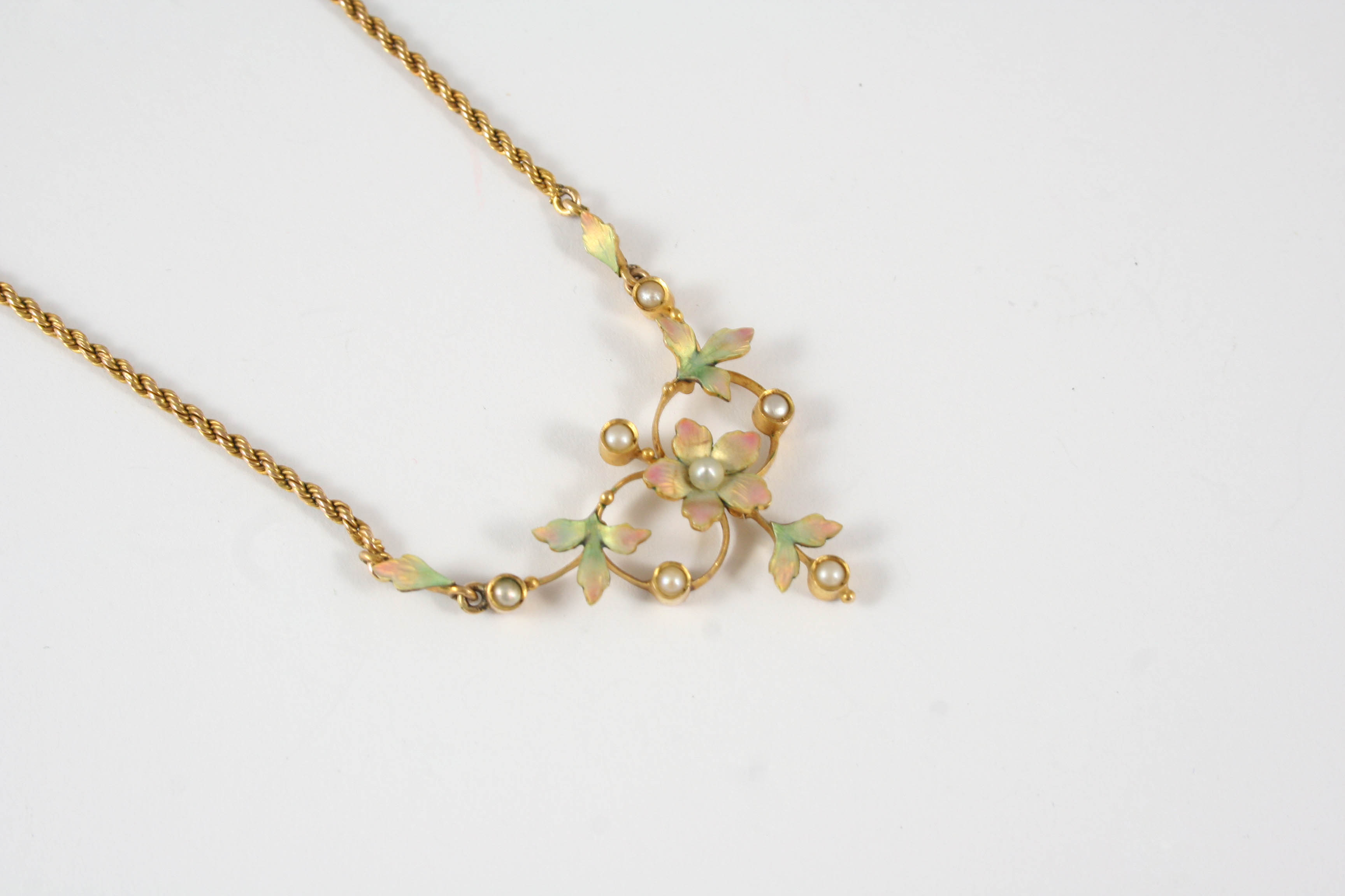 AN ENAMEL, PEARL AND GOLD NECKLACE the foliate necklace with enamel decoration and mounted with