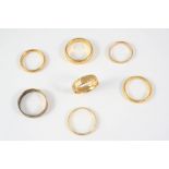 A 22CT. GOLD WEDDING BAND 9.2 grams, size R, together with three other 22ct. gold wedding bands,