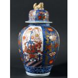 JAPANESE IMARI VASE AND COVER, circa 1900, of ovoid form with alternating panels of flowers and