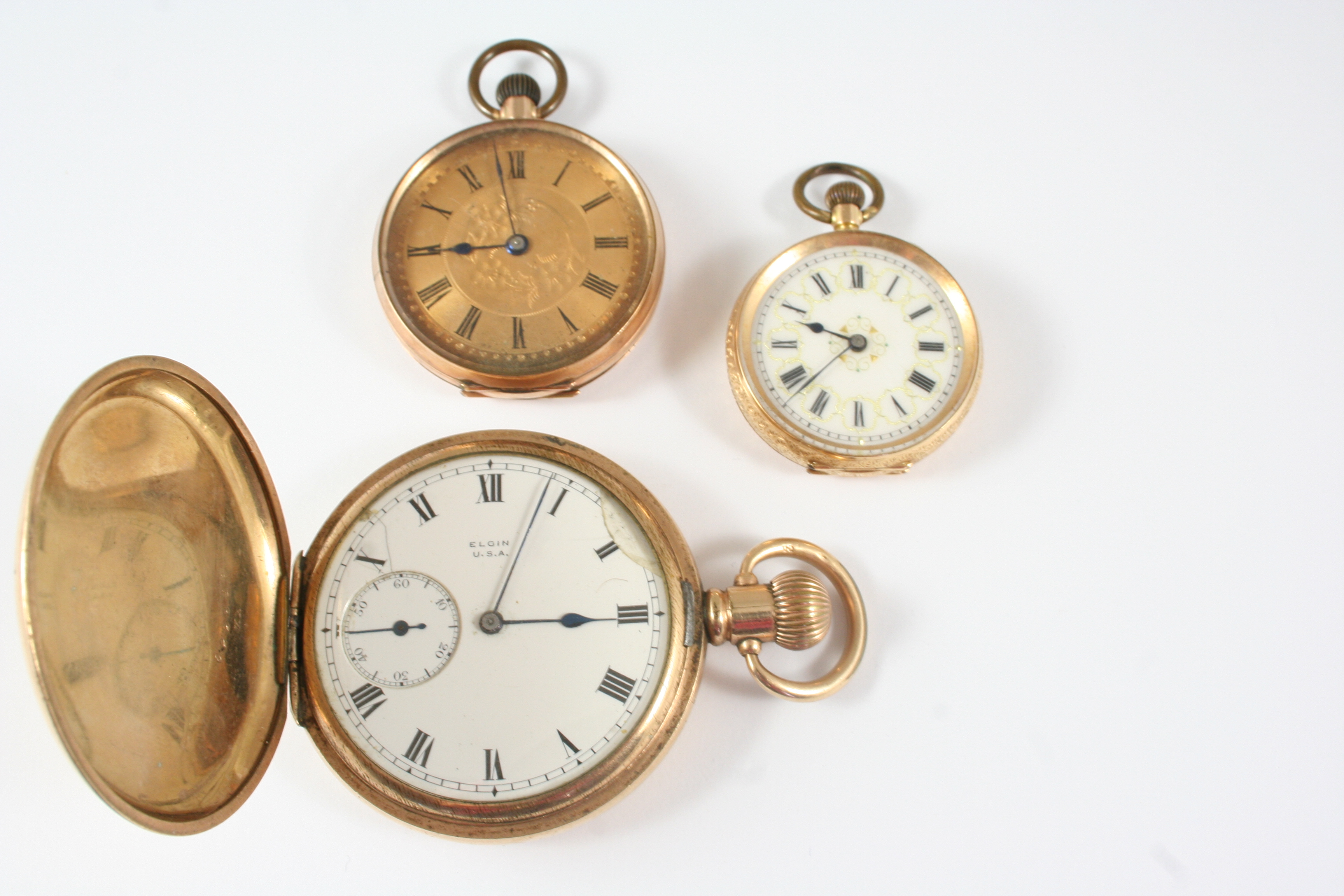 A LADY'S 14CT. GOLD OPEN FACED FOB WATCH the white enamel dial with Roman numerals and foliate
