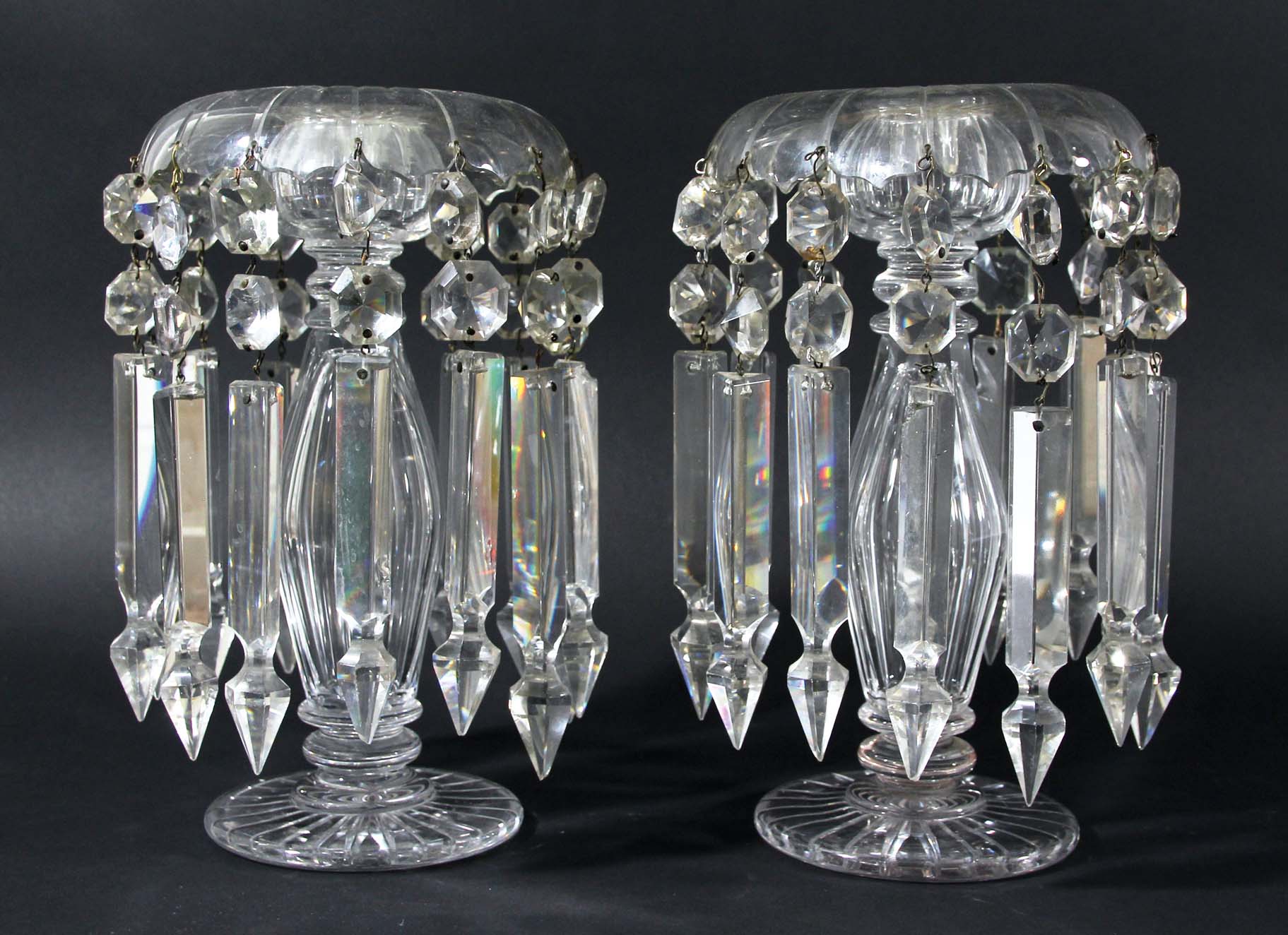 PAIR OF CLEAR GLASS LUSTRES, the drops around a central, hollow swollen column, and spreading