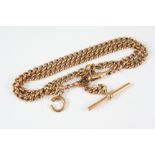 A 9CT. GOLD CURB LINK WATCH CHAIN suspending a 9ct. gold 't' bar, 42cm. long, 42.1 grams.