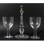 VICTORIAN GLASS CANDLESTICK, the brass holder above a wrythen and knopped column and spreading foot,