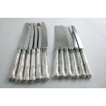 A LATE 20TH CENTURY SET OF SIX HOURGLASS PATTERN TABLE KNIVES & SIX SIDE KNIVES TO MATCH, with