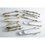 EIGHTEEN VARIOUS PAIRS OF SUGAR TONGS (including a French pair and an Old Sheffield plated pair),