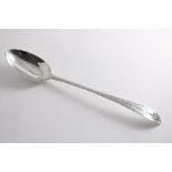 A GEORGE III IRISH BASTING SPOON bright,cut and star pattern, with a pointed end, crested, by John