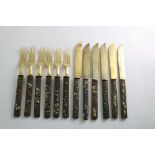 A SET OF SIX LATE 19TH CENTURY JAPANESE DESSERT KNIVES & FORKS with gilt-steel blades & tines, and