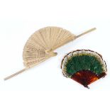 A BAMBOO "COCKADE" FAN with shaped leaves; 26 cms and a tortoiseshell and feather fan; 10 cms,
