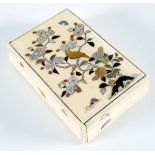 A JAPANESE IVORY BOX with shibayama decoration of a bird in a flowering tree, c.1900; 9.5 x 6 cms