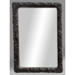 CHINESE RECTANGULAR HARDWOOD FRAME, carved with flowering prunus, currently fitted with a mirror,